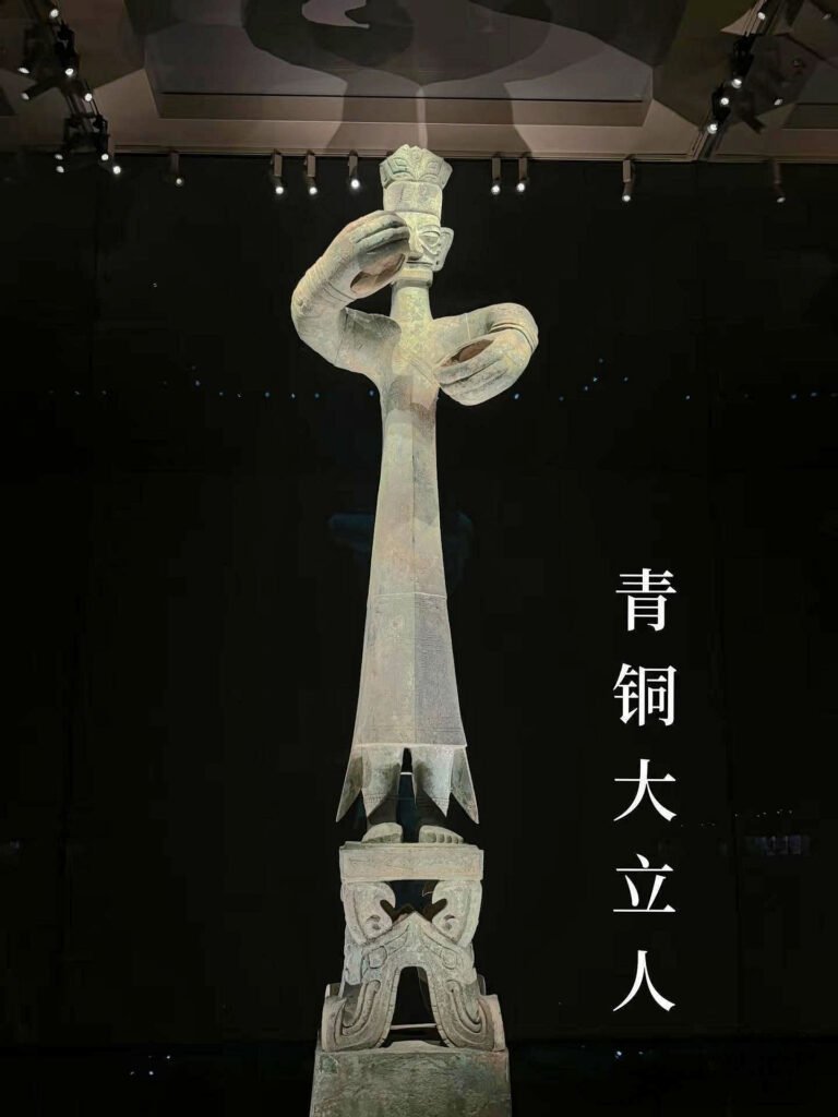 san xing dui bronze standing figure